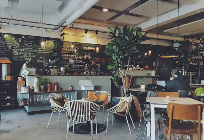 Café interior with seating and a coffee bar